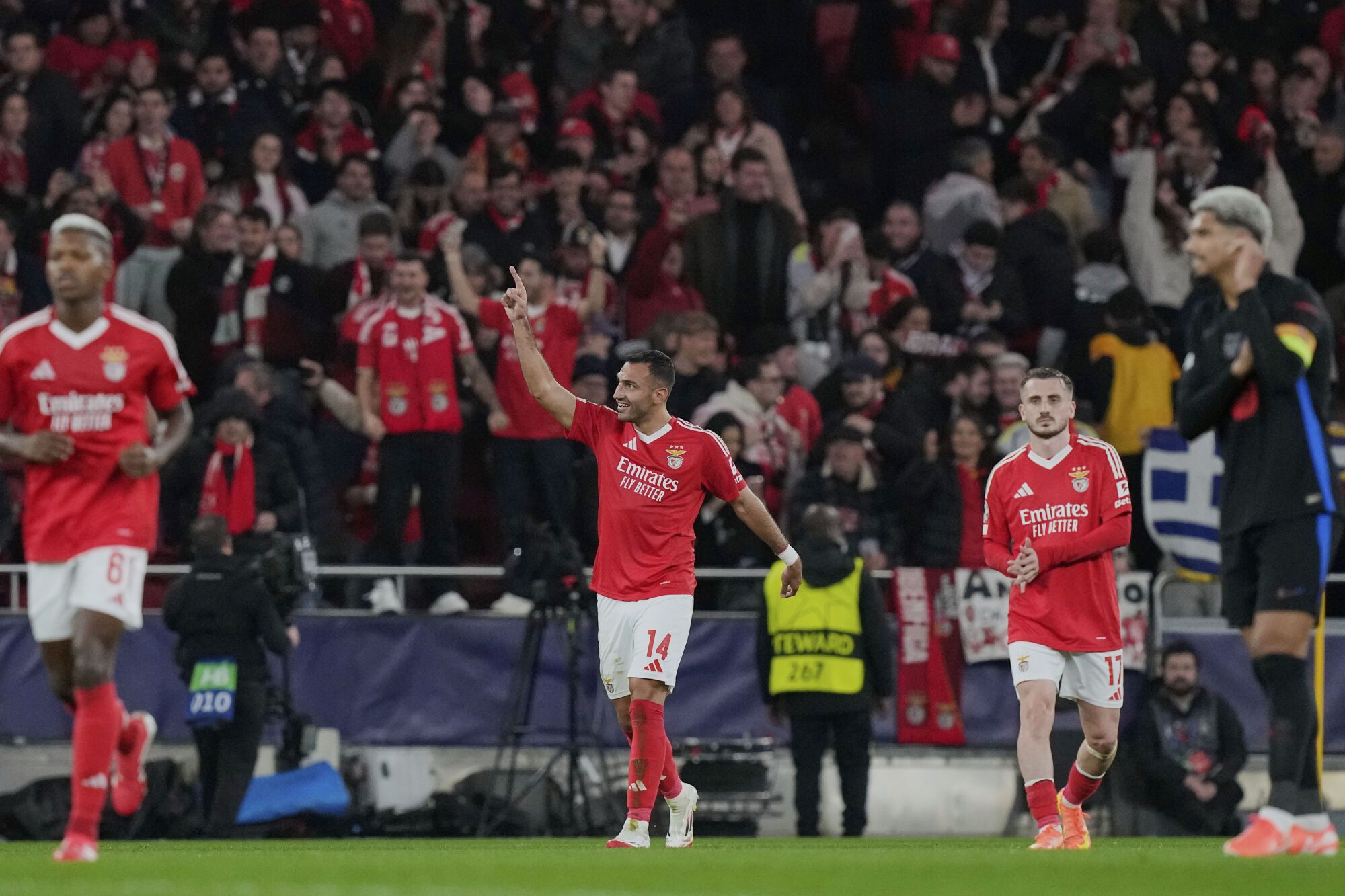 Benfica's Vangelis Pavlidis celebrates his side's third goal during a Champions League opening phase soccer match between SL Benfica and FC Barcelona at the Luz stadium in Lisbon, Tuesday, Jan. 21, 2025. (AP Photo/Armando Franca)