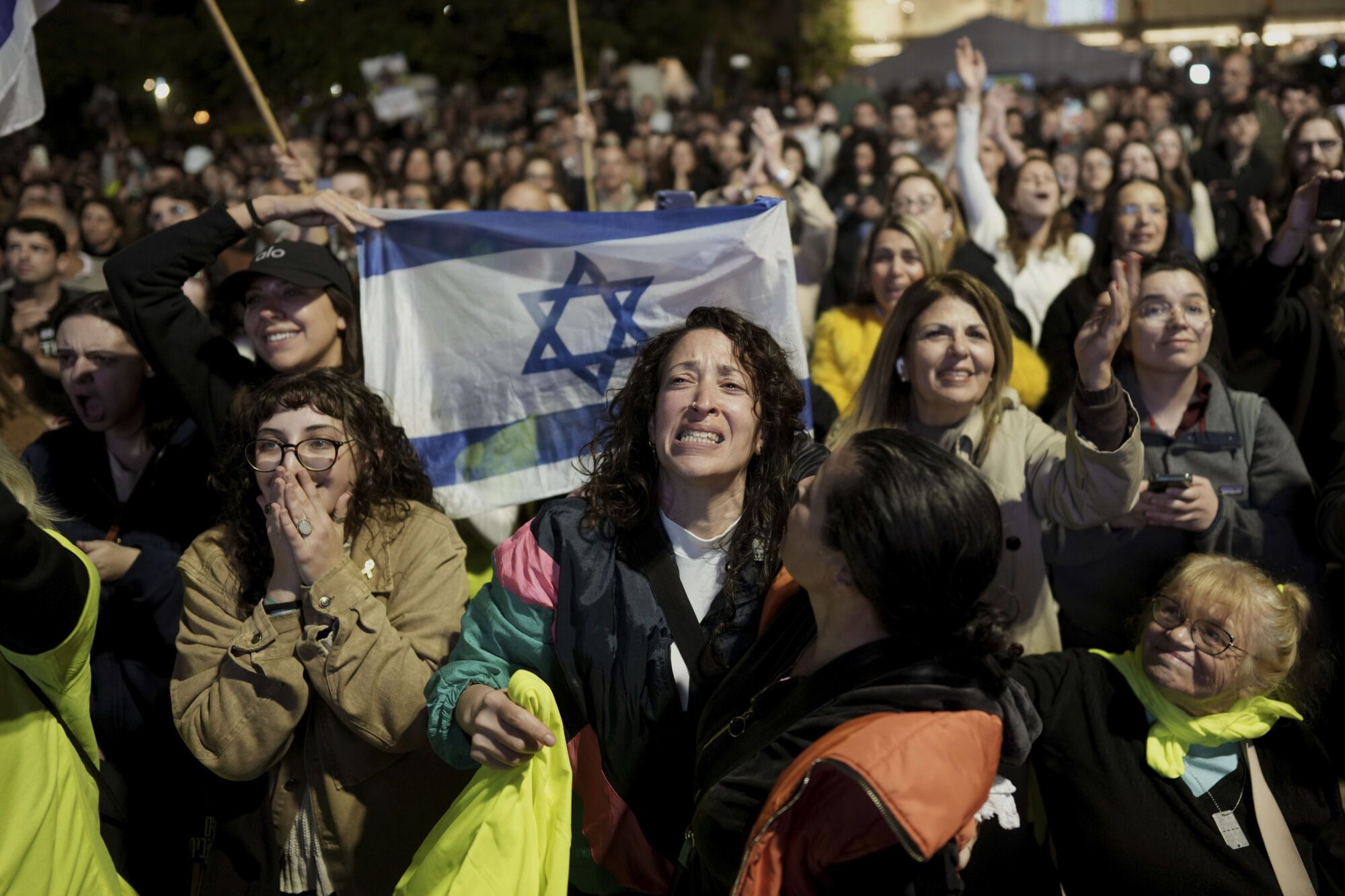 Relatives and friends of people killed and abducted by Hamas and taken into Gaza, react to the news of the hostages' release, as they gather in Tel Aviv, Israel on Sunday, Jan. 19, 2025. (AP Photo/Oded Balilty) associated  Press / LaPresse Only italy and Spain. EDITORIAL USE ONLY/ONLY ITALY AND SPAIN