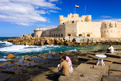 A couple in front of Fort Qaitbey, in Alexandria, Egypt.