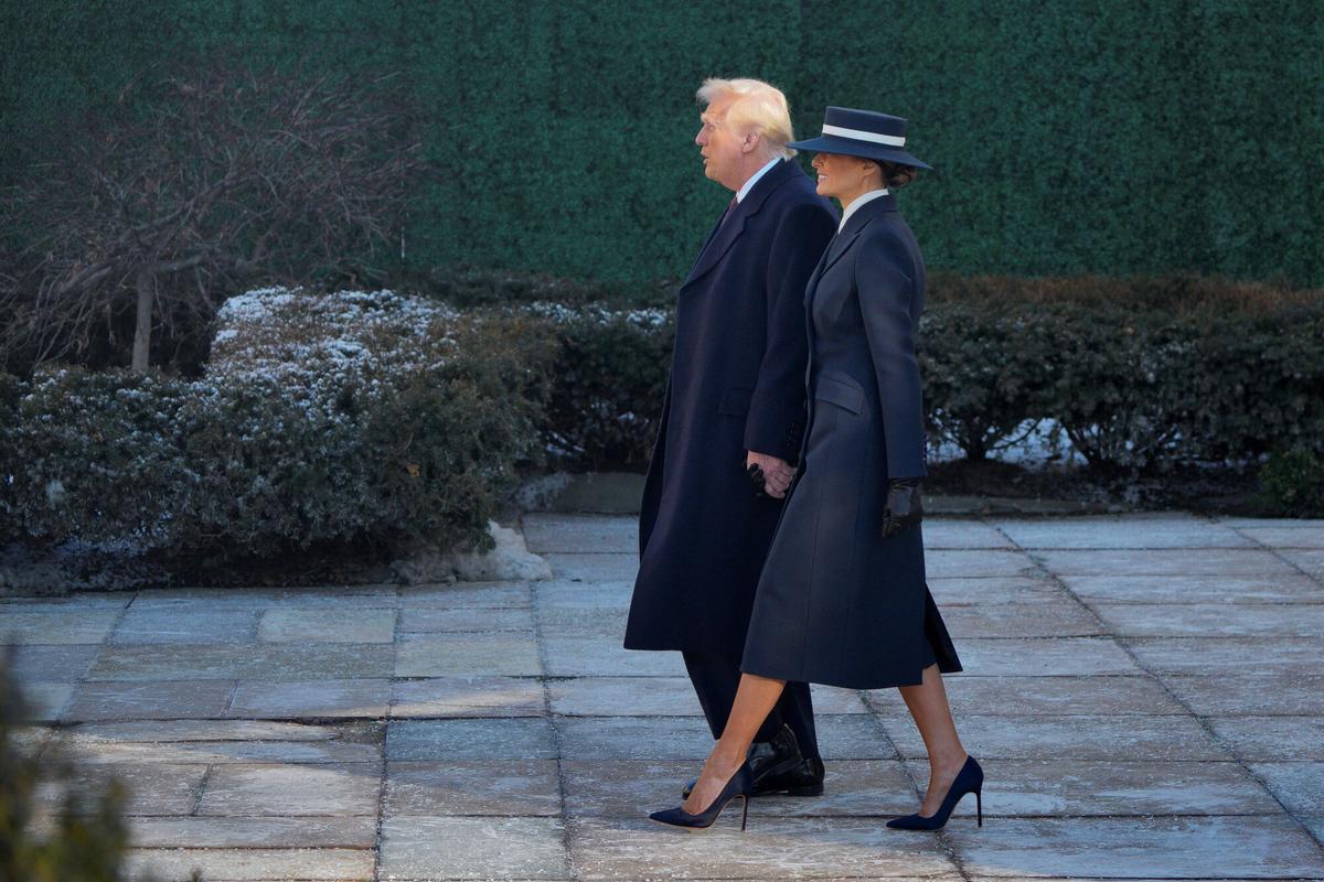 U.S. President-elect Donald Trump and his wife Melania Trump walk after attending a service at St. John's Church on Inauguration Day of Donald Trump's second presidential term in Washington, U.S. January 20, 2025. REUTERS/Jeenah Moon