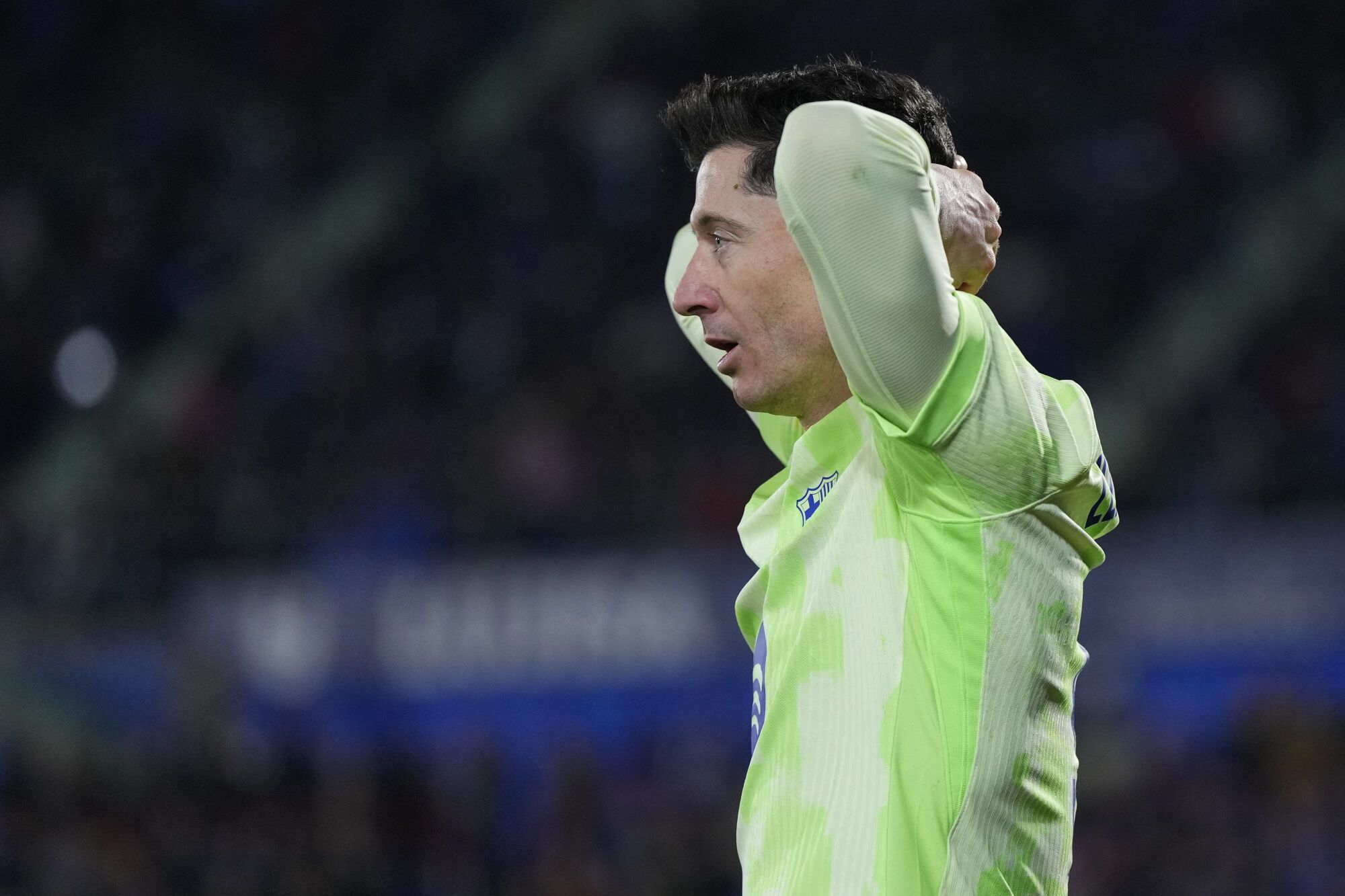 Robert Lewandowski del Barcelona reacciona después de perder la oportunidad de anotar contra Getafe durante un partido de fútbol de la Liga española en el estadio Coliseum Alfonso Pérez en Getafe, España, el sábado 18 de enero de 2025. (Foto AP/Manu Fernández). SÓLO USO EDITORIAL / SÓLO ITALIA Y ESPAÑA