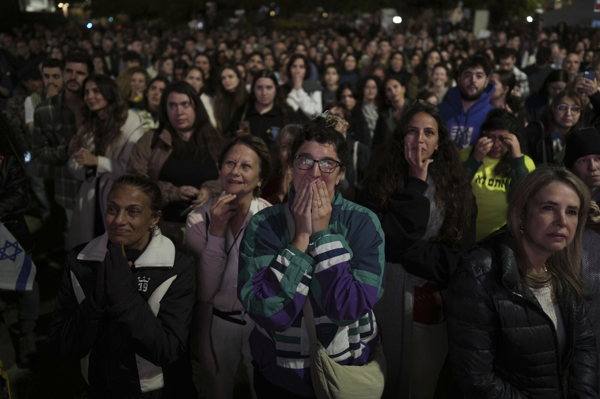 Relatives and friends of people killed and abducted by Hamas and taken into Gaza, react to the news of the hostages' release, as they gather in Tel Aviv, Israel on Sunday, Jan. 19, 2025. (AP Photo/Oded Balilty) associated  Press / LaPresse Only italy and Spain. EDITORIAL USE ONLY/ONLY ITALY AND SPAIN