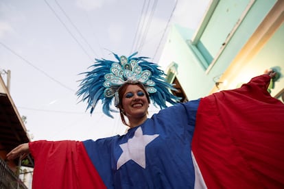 A woman dressed with the Puerto Rican flag colors takes part in the inauguration day of the 55th edition of the annual San Sebastian Street Festival in Old San Juan, Puerto Rico, January 16, 2025.,Image: 954346556, License: Rights-managed, Restrictions: , Model Release: no, Credit line: Ricardo Arduengo (Reuters / Contacto)