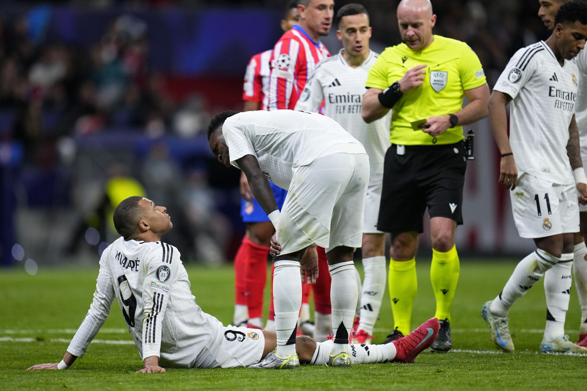 Real Madrid's vinicius Junior Speaks with Teammate Kylian Mbappe, Left, Before Taking A penalty shot during the champions league round of 16, second leg, soccer match Between athletic Madrid and Real Madrid at the metropolitan Photo/Manu Fernandez)