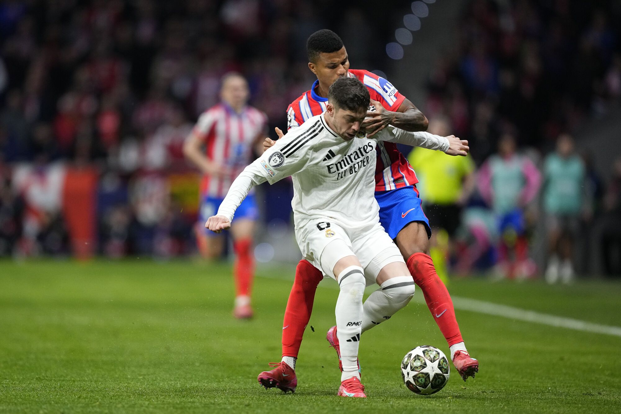 Federico Valverde of Real Madrid and Reinildo Mandava of Athletic of Madrid in Action During the UEFA Champions League 2024/25 League Round of 16 Second Leg Leg Match Between Athletic of Madrid and Real Madrid CF, At Riyadh Air Metropolitan Stadium on March 12, 2025, In Madrid, Spain. AFP7 03/12/2025 ONLY FOR USE IN SPAIN. Oscar J. Barroso / AFP7 / Europa Press; 2025; Soccer; Spain; Sport; Zsoccer; Zsport; Atletico de Madrid V Real Madrid CF - UEFA Champions League 2024/25 League Round of 16 Second Leg;