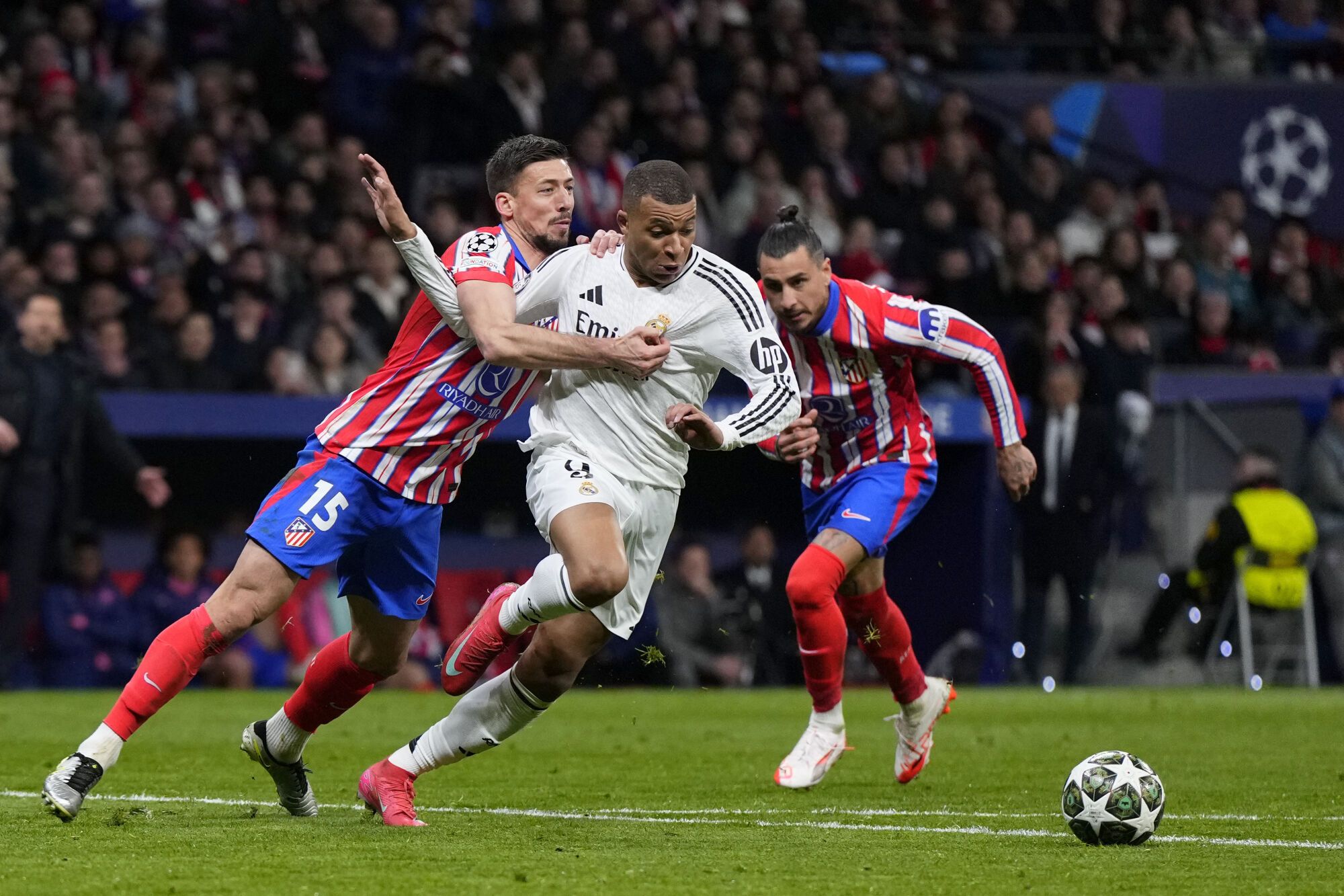 Atletico Madrid's Clement Lenglet, Left, Fouls Real Madrid's Kylian Mbappe During the Champions League Round of 16, Second Leg, Soccer Match Between Athletic Madrid and Real Madrid at The Metropolitan Stadium in Madrid, Spain, Wednesday, March 12, 2025. (Ap Photo/Manu Fernandez). Editorial Use Only/Only Italy And Spain