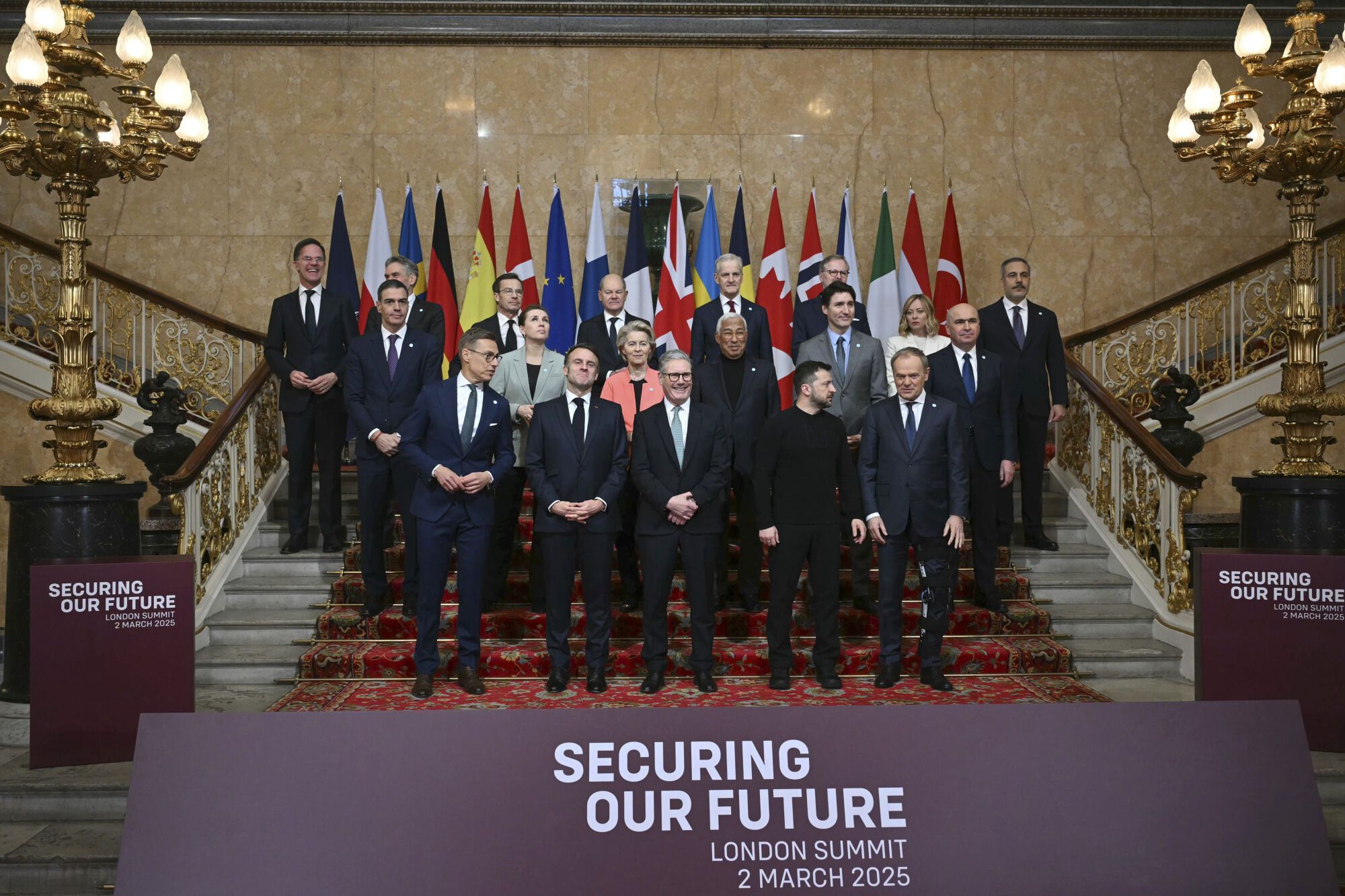 Britain's Prime Minister Keir Starmer, front center, hosts the European leaders' summit to discuss Ukraine, at Lancaster House, London, Sunday March 2, 2025. Front row from left, Finland's President Alexander Stubb, France's President Emmanuel Macron, Britain's Prime Minister Keir Starmer, Ukraine's President Volodymyr Zelenskyy and Poland's Prime Minister Donald Tusk. Center row from left, Spain's Prime Minister Pedro Sanchez, Denmark's Prime Minister Mette Frederiksen, European Commission President Ursula von der Leyen, European Council President Antonio Costa, Canada's Prime Minister Justin Trudeau, and Romania's Interim President Ilie Bolojan. Back row from left, NATO secretary General Mark Rutte, Netherlands' Prime Minister Dick Schoof, Sweden's Prime Minister Ulf Kristersson, Germany's Chancellor Olaf Scholz, Norway's Prime Minister Jonas Gahr Store, Czech Republic's Prime Minister Petr Fiala, Italy's Prime Minister Giorgia Meloni and Turkey's Minister of Foreign Affairs Hakan Fidan. (Justin Tallis/Pool via AP). EDITORIAL USE ONLY / ONLY ITALY AND SPAIN