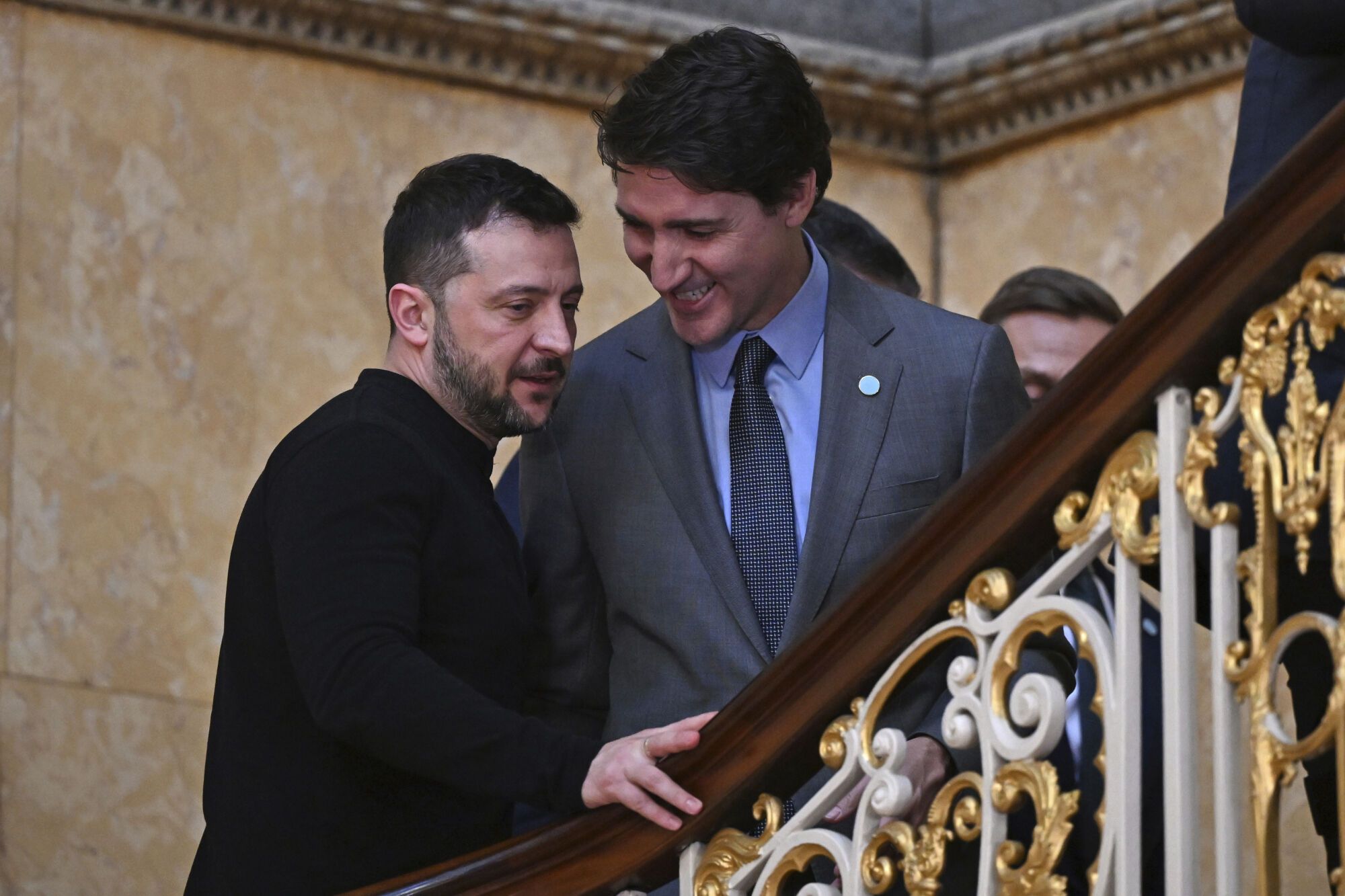 Ukraine's President Volodymyr Zelenskyy, left, and Canada's Prime Minister Justin Trudeau speak before the European leaders' summit to discuss Ukraine, hosted by Britain's Prime Minister Keir Starmer, at Lancaster House, London, Sunday March 2, 2025. (Justin Tallis/Pool via AP). EDITORIAL USE ONLY / ONLY ITALY AND SPAIN