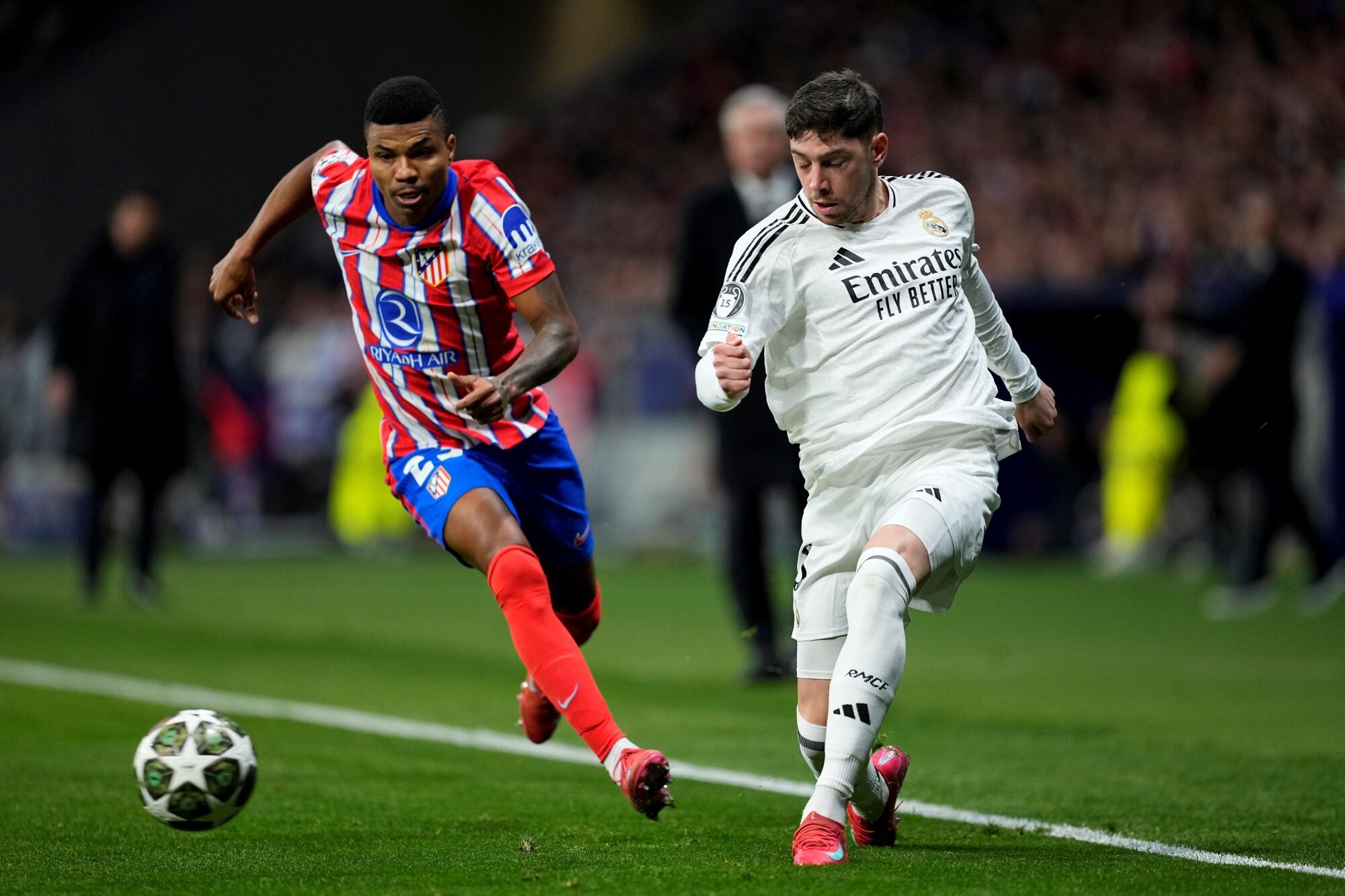 Federico Valverde of Real Madrid and Reinildo Mandava of Athletic of Madrid in Action During the UEFA Champions League 2024/25 League Round of 16 Second Leg Leg Match Between Athletic of Madrid and Real Madrid CF, At Riyadh Air Metropolitan Stadium on March 12, 2025, In Madrid, Spain. AFP7 03/12/2025 ONLY FOR USE IN SPAIN. Oscar J. Barroso / AFP7 / Europa Press; 2025; Soccer; Spain; Sport; Zsoccer; Zsport; Atletico de Madrid V Real Madrid CF - UEFA Champions League 2024/25 League Round of 16 Second Leg;